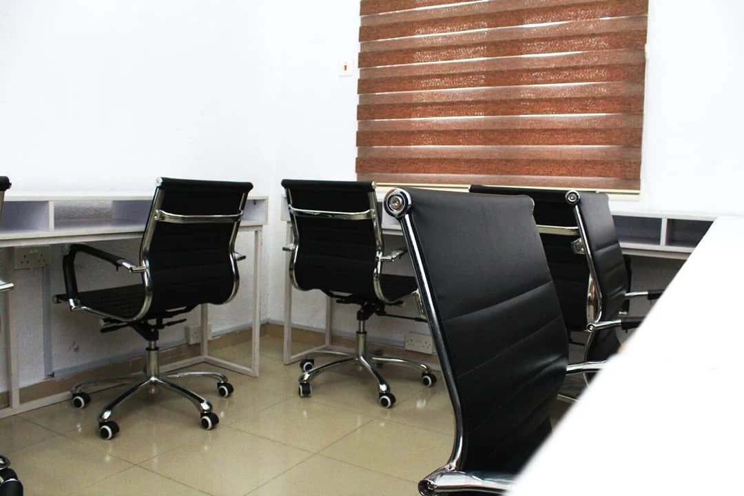Shared workspace with desks and office chairs